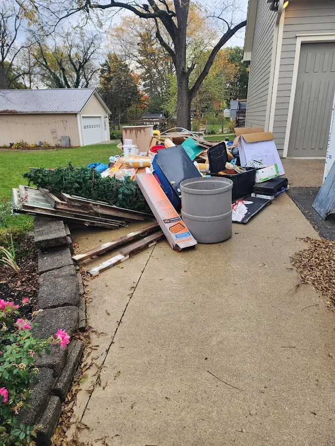 Dumpster being loaded with debris for 3 Yard Dumpster Rental in Eagleton Village